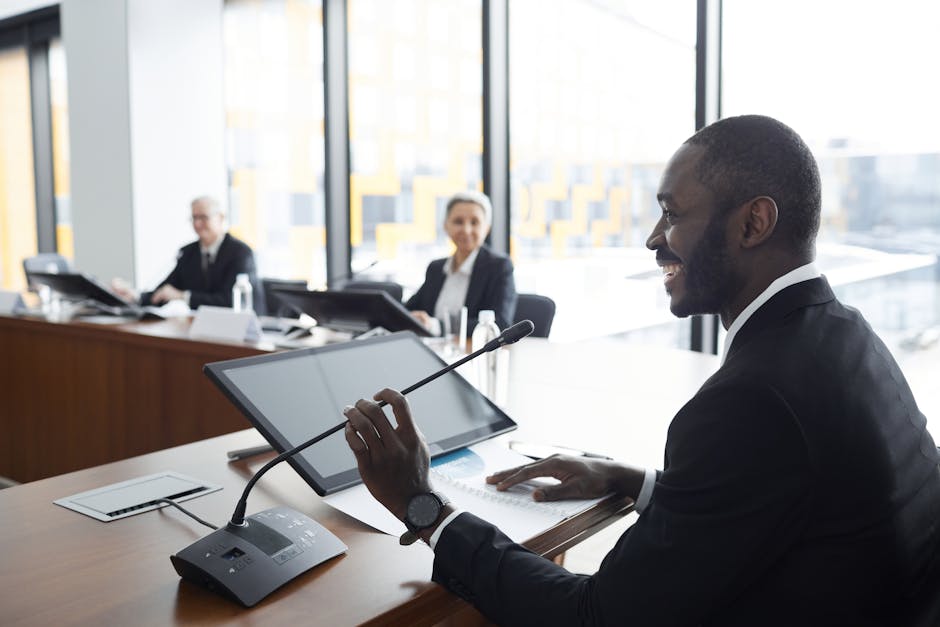 Professional business meeting with smiling participants discussing strategies at a conference table